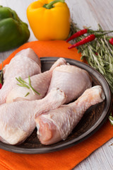 Fresh chicken on wooden table