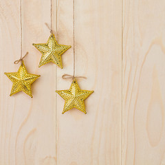 Fototapeta na wymiar Ornamental stars on wooden background