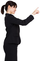Smiling businesswoman pointing