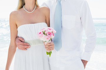 Couple embracing on their wedding day