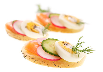Canape with egg, salmon and vegetables