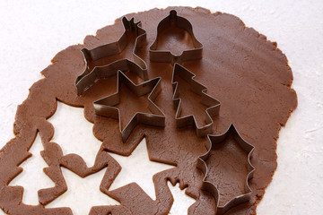 Cookie cutters and shapes in gingerbread dough
