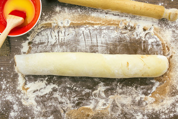 Rolled cinnamon roll before cutting up