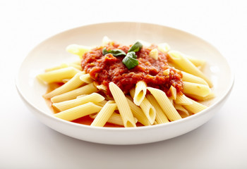 Traditional italian pasta with tomato sauce and basil