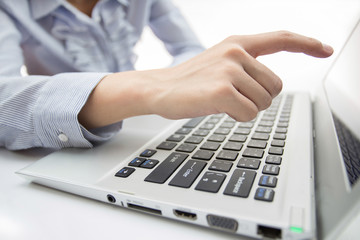 Hands of business woman with laptop computer