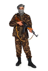 Arab nationality in camouflage suit and keffiyeh with automatic