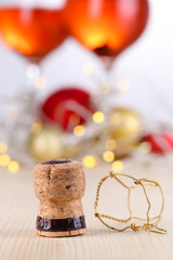 Champagne cork on Christmas lights background