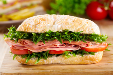 sandwich with bacon and vegetables