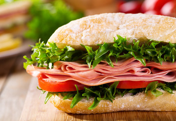 sandwich with bacon and vegetables
