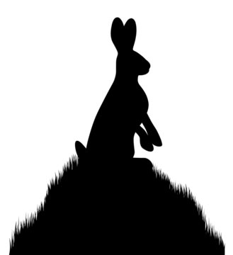 Schwarze Silhouette eines Hasen auf einem Grashügel - Vektor