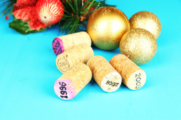 Wine corks with new Year toys on wooden table close-up