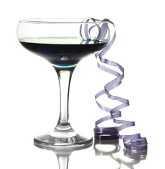 Glass of cocktail and streamer after party isolated on white