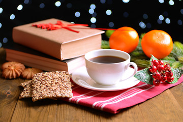 Composition of book with cup of coffee and Christmas