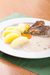 Beef rolls with vegetable filling with potatoes and sauce