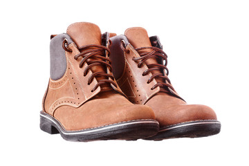 A pair of new brown hiking boots on white background