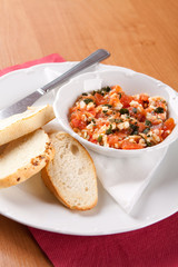 Toast spread with tomatoes, grated cheese and celer