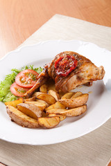 Packaged rabbit in olive oil with potatoes