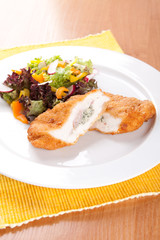 Chicken fillet with blue cheese and vegetables