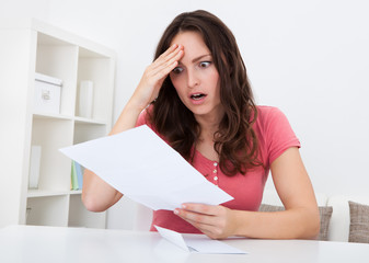 Sad Woman Reading Paper