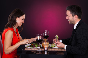 Young Couple Having Dinner With Wine