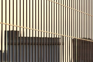 Windows of an office building mirroring a nearby building