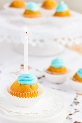 tiny cupcake with burning candle