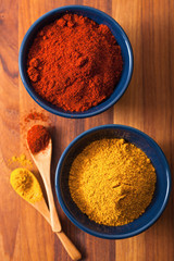 spices in bowls: curry and paprika powder