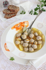 Portion of fresh homemade soup with meat balls