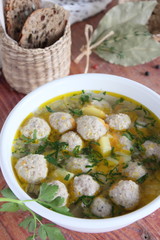 Portion of fresh homemade soup with meat balls