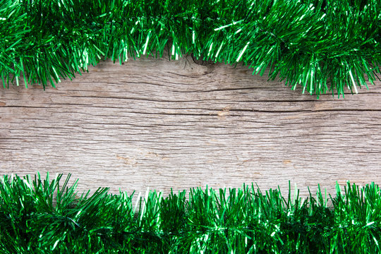 Green Garland On The Wooden Background