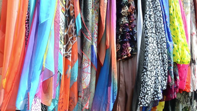 multicolor cloaks shawls and scarves sold in market fair