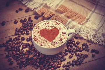 Cup of coffee on wooden table.