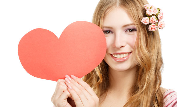 Beautiful young smiling woman with red paper valentine heart