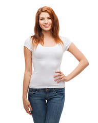 Fototapeta premium smiling teenager in blank white t-shirt