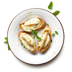 Crostini with anchovy and mozzarella  on the white background