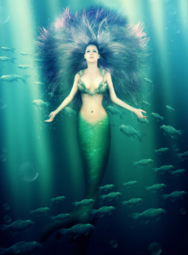 beautiful woman mermaid in the sea