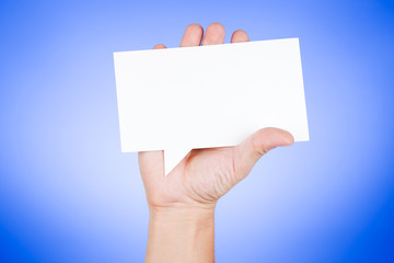 Man holding blank paper speech bubble