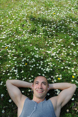 Man listening musik on the grass