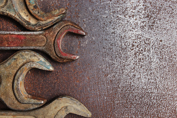 Old wrenches on a metal table