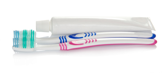 Toothpaste and two toothbrushes