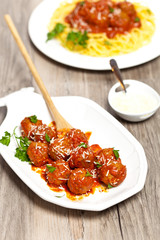 Meatballs in tomato sauce with parsley