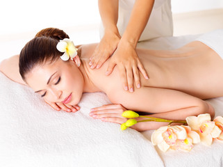 Plakat Woman having massage of body in spa salon