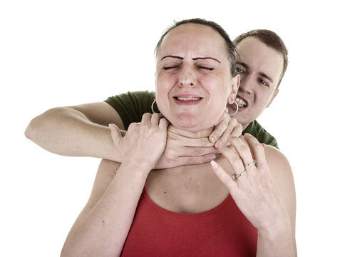 woman being strangled from behind by man on white background