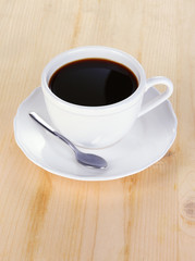 Obraz na płótnie Canvas Coffee cup on wooden table close-up
