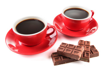 Red cups of strong coffee and chocolate bars isolated on white