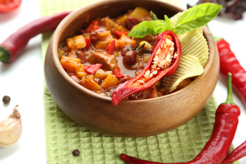 Chili Corn Carne - traditional mexican food, in wooden bowl,