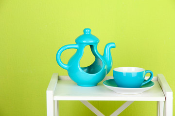 Teapot-vase with cup of tea