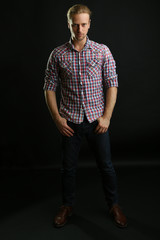 Fashion young model poses at studio