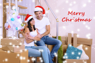 Obraz premium Young couple celebrating New Years in new home