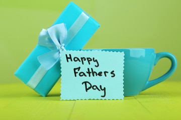 Happy Fathers Day tag with gift box and cup,